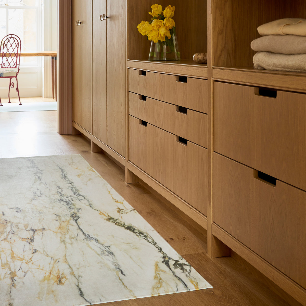 Marble / Gold woven floor mat by Chilewich, interior setting