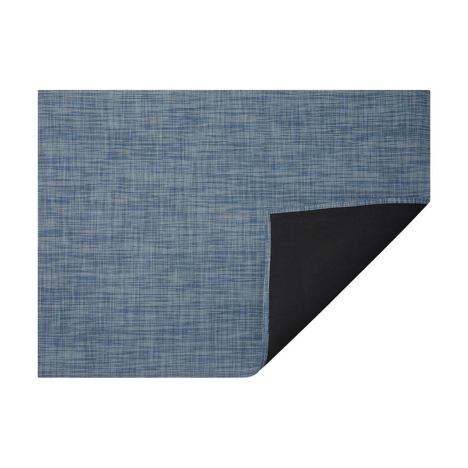 Chambray Mini Basketweave woven floor mat by Chilewich, horizontal folded-corner view
