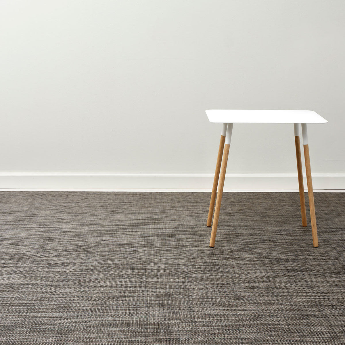 Mini Basketweave / Dark Walnut woven floor mat by Chilewich, interior setting
