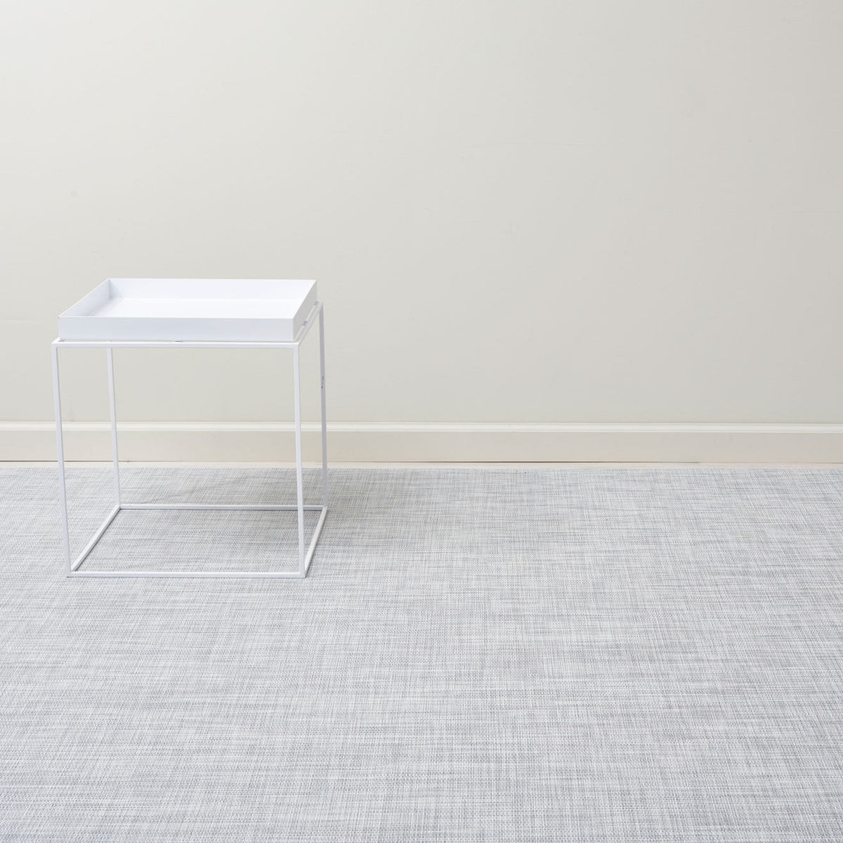 Mini Basketweave / Mist woven floor mat by Chilewich, interior setting