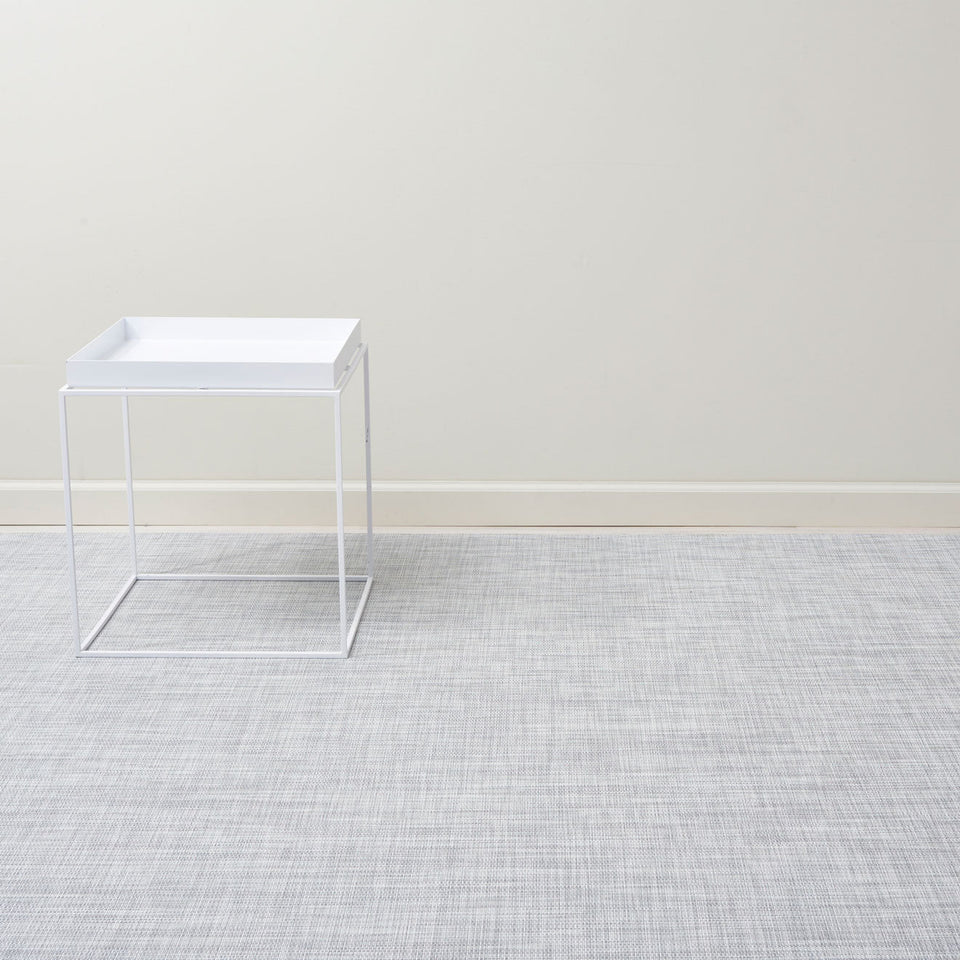 Mini Basketweave / Mist woven floor mat by Chilewich, interior setting