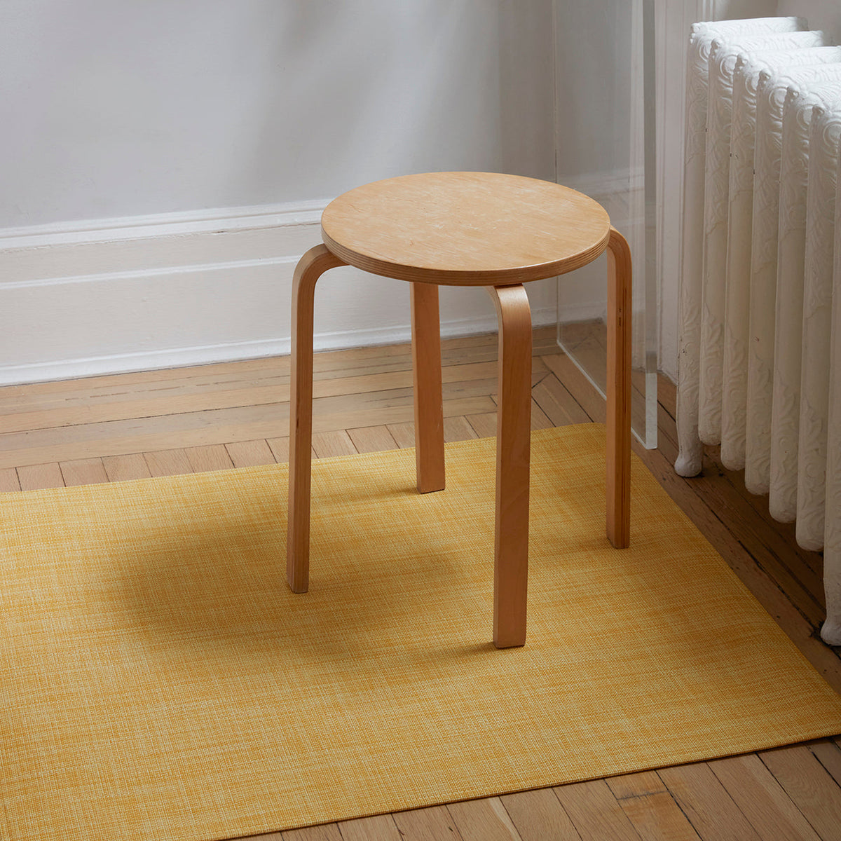 Mini Basketweave / Ochre woven floor mat by Chilewich, interior setting