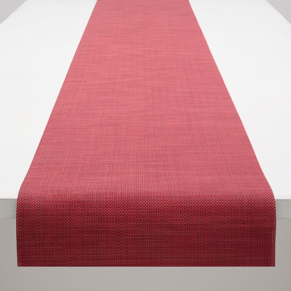 Chilewich Mini Basketweave runner in Scarlet, draped along a table