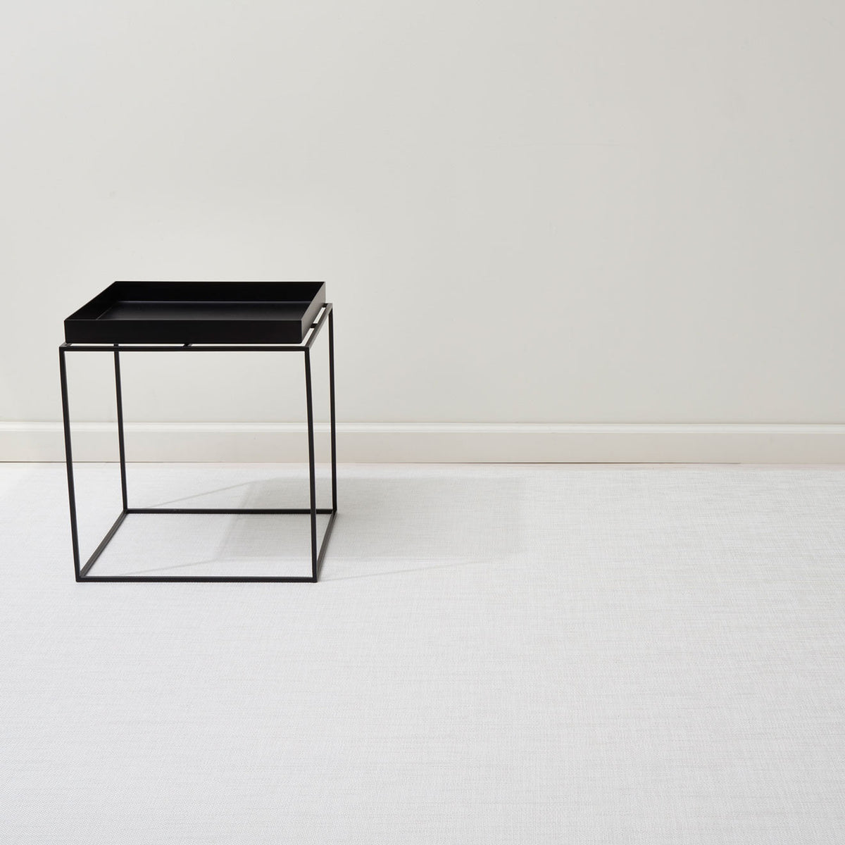 Mini Basketweave / White woven floor mat by Chilewich, interior setting