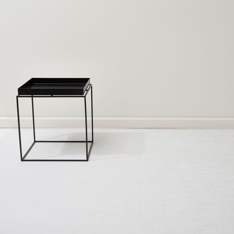 Mini Basketweave / White woven floor mat by Chilewich, interior setting