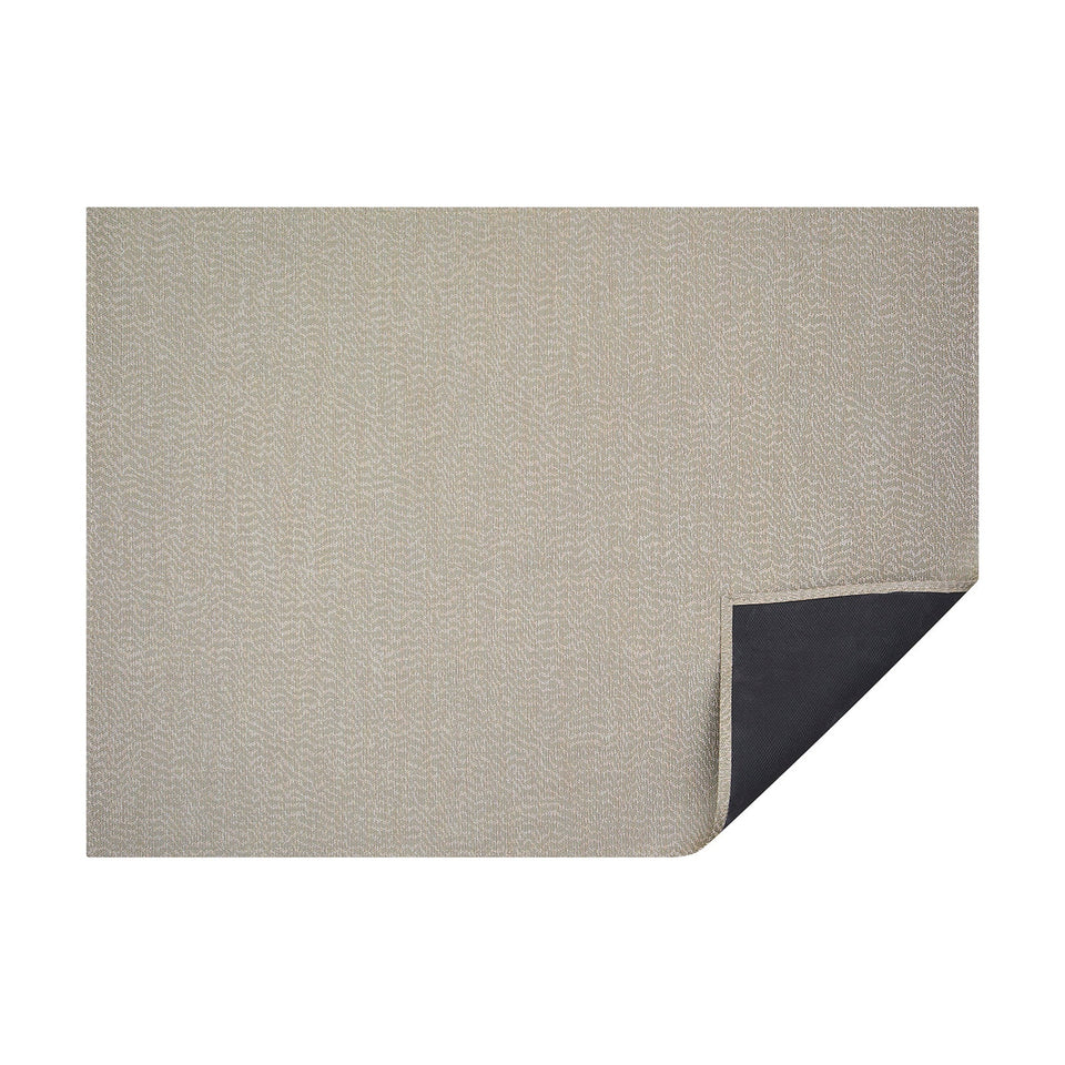 Mica Moiré woven floor mat by Chilewich, horizontal folded-corner view