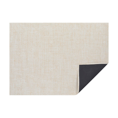 Almond Mosaic woven floor mat by Chilewich, horizontal folded-corner view