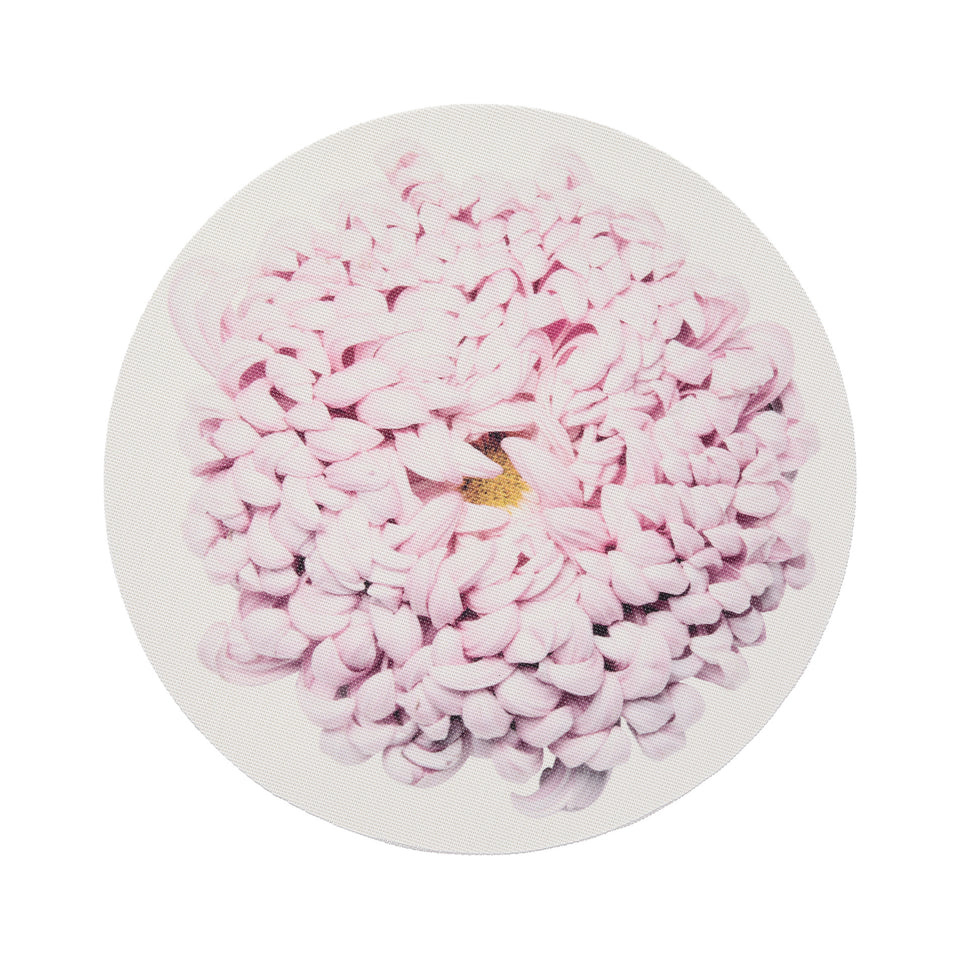 Chilewich Mums round placemat in Blush, viewed from above on a white background