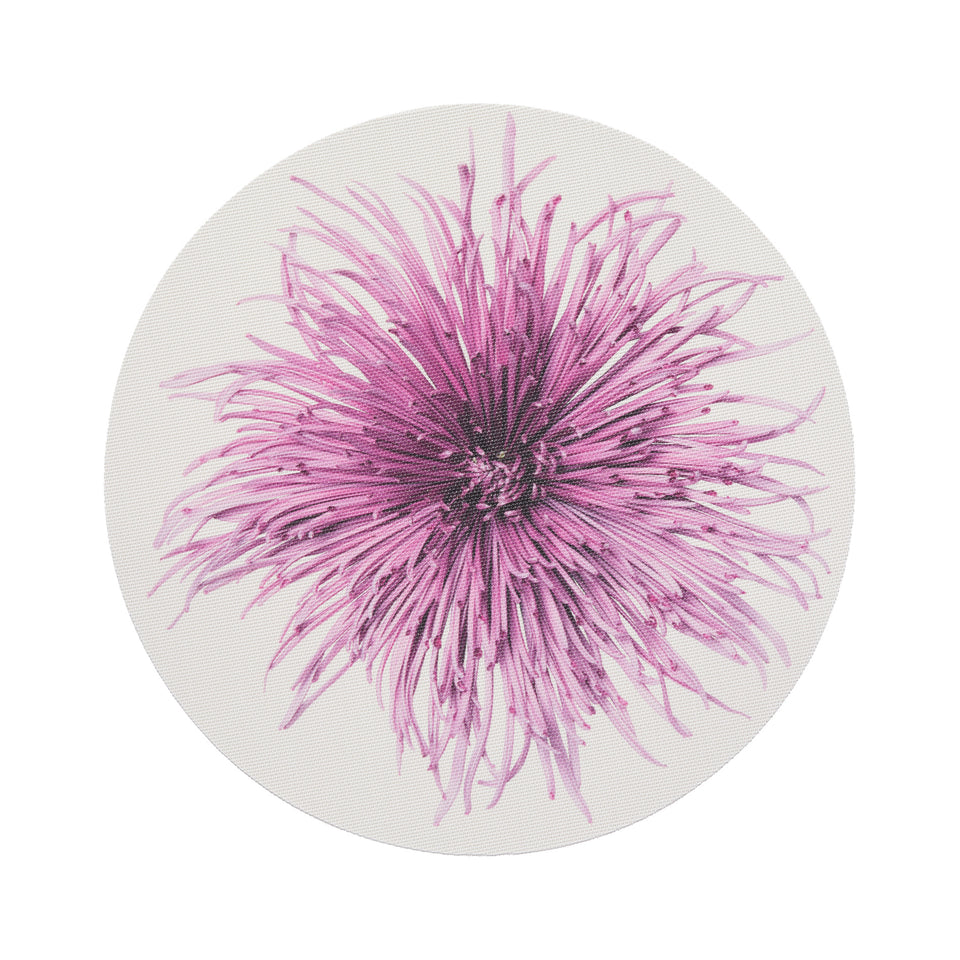 Chilewich Mums round placemat in Plum, viewed from above on a white background