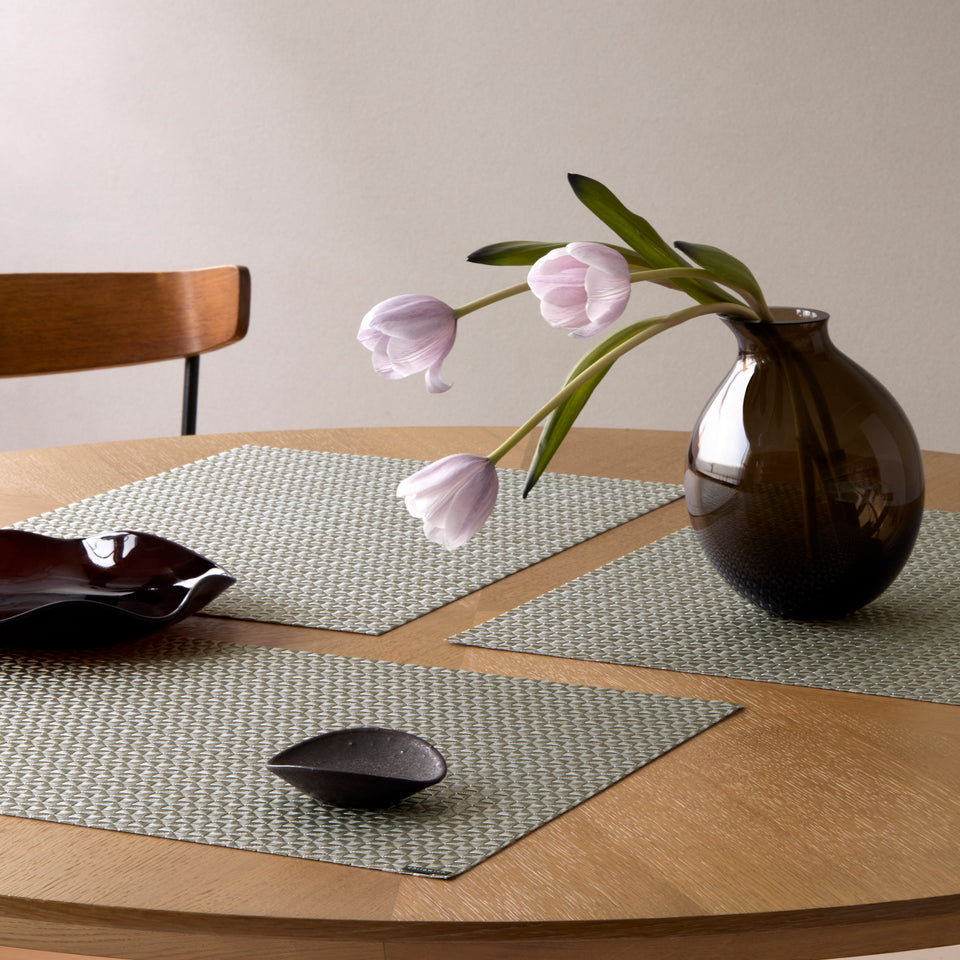 Chilewich Origami in Gunmetal, shown in a styled table setting