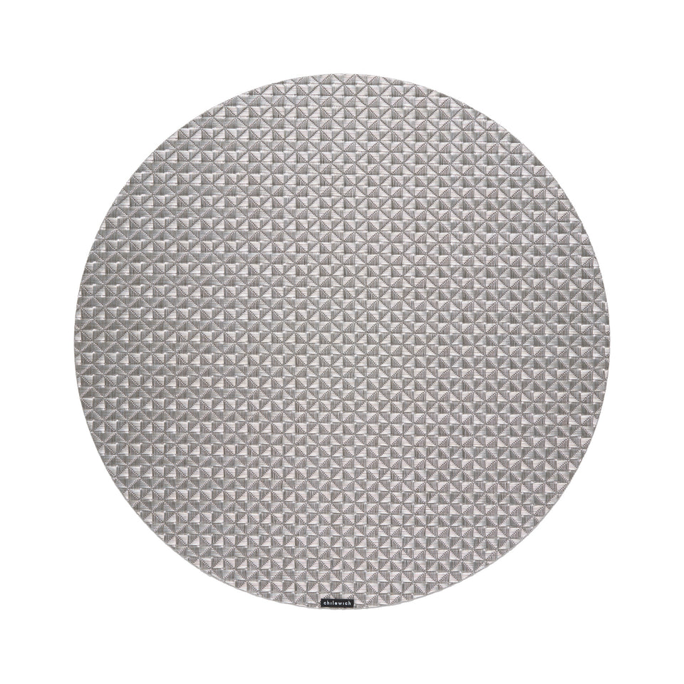 Chilewich Origami round placemat in Gunmetal, viewed from above on a white background