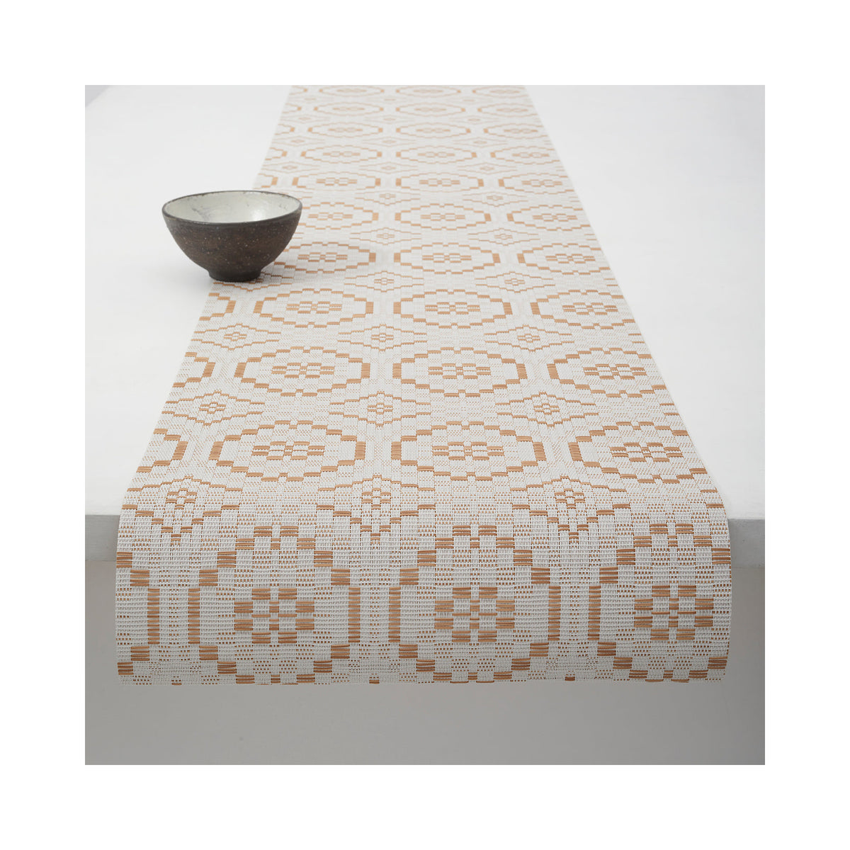 Chilewich Overshot table runner in Butterscotch, draped across a table