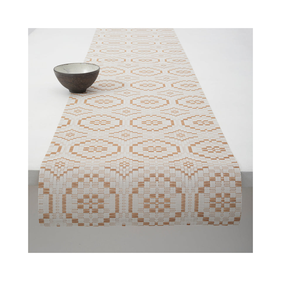 Chilewich Overshot table runner in Butterscotch, draped across a table