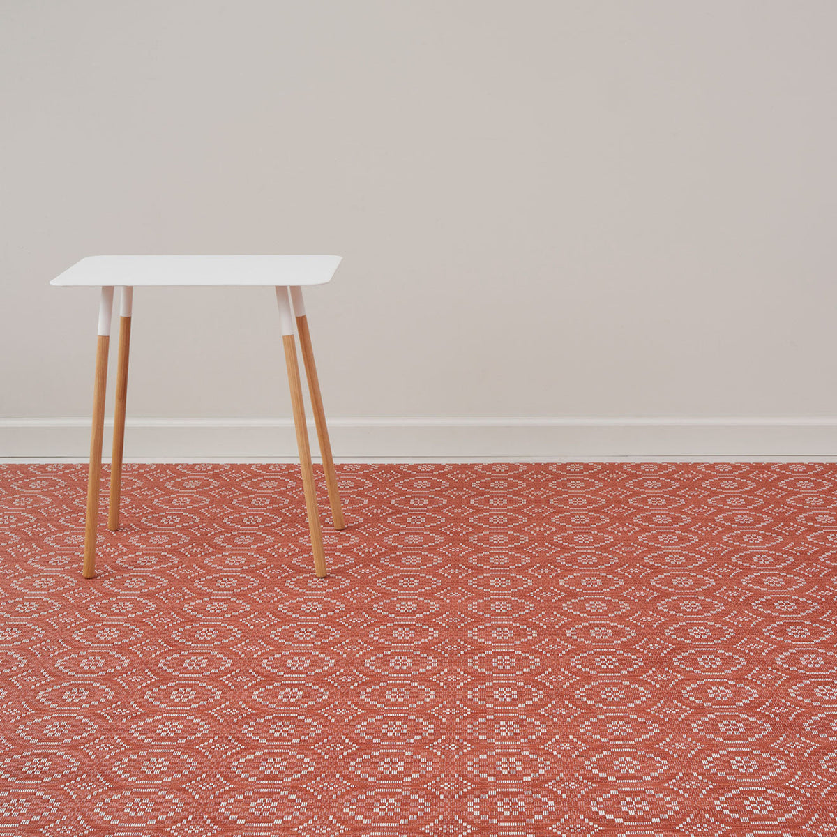 Overshot / Paprika woven floor mat by Chilewich, interior setting