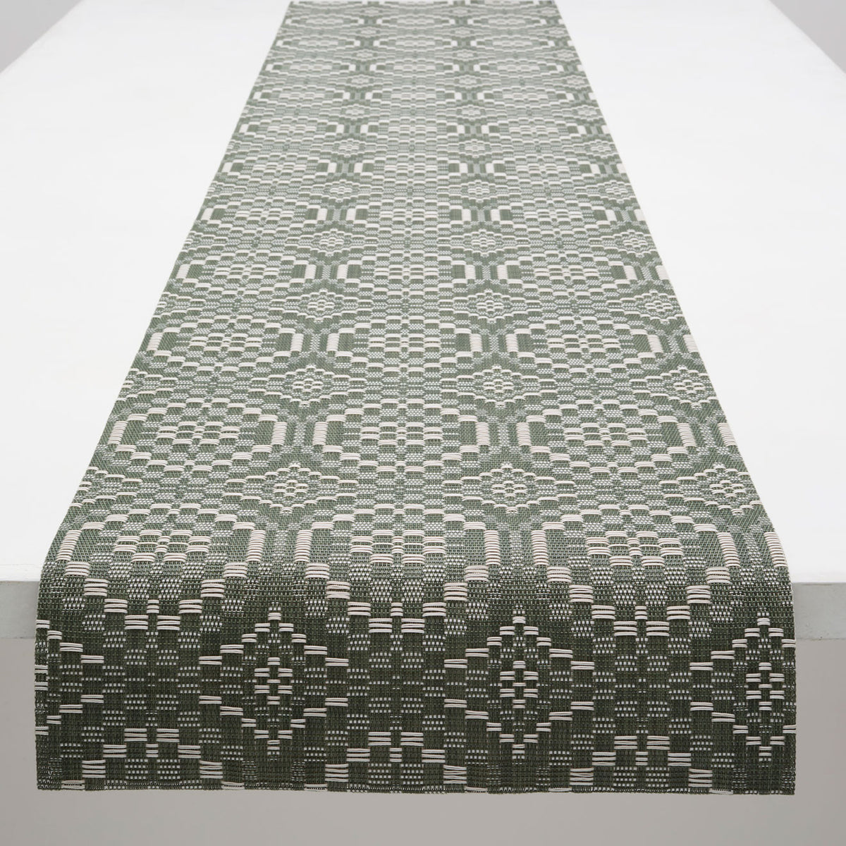 Chilewich Overshot runner in Thyme, draped along a table