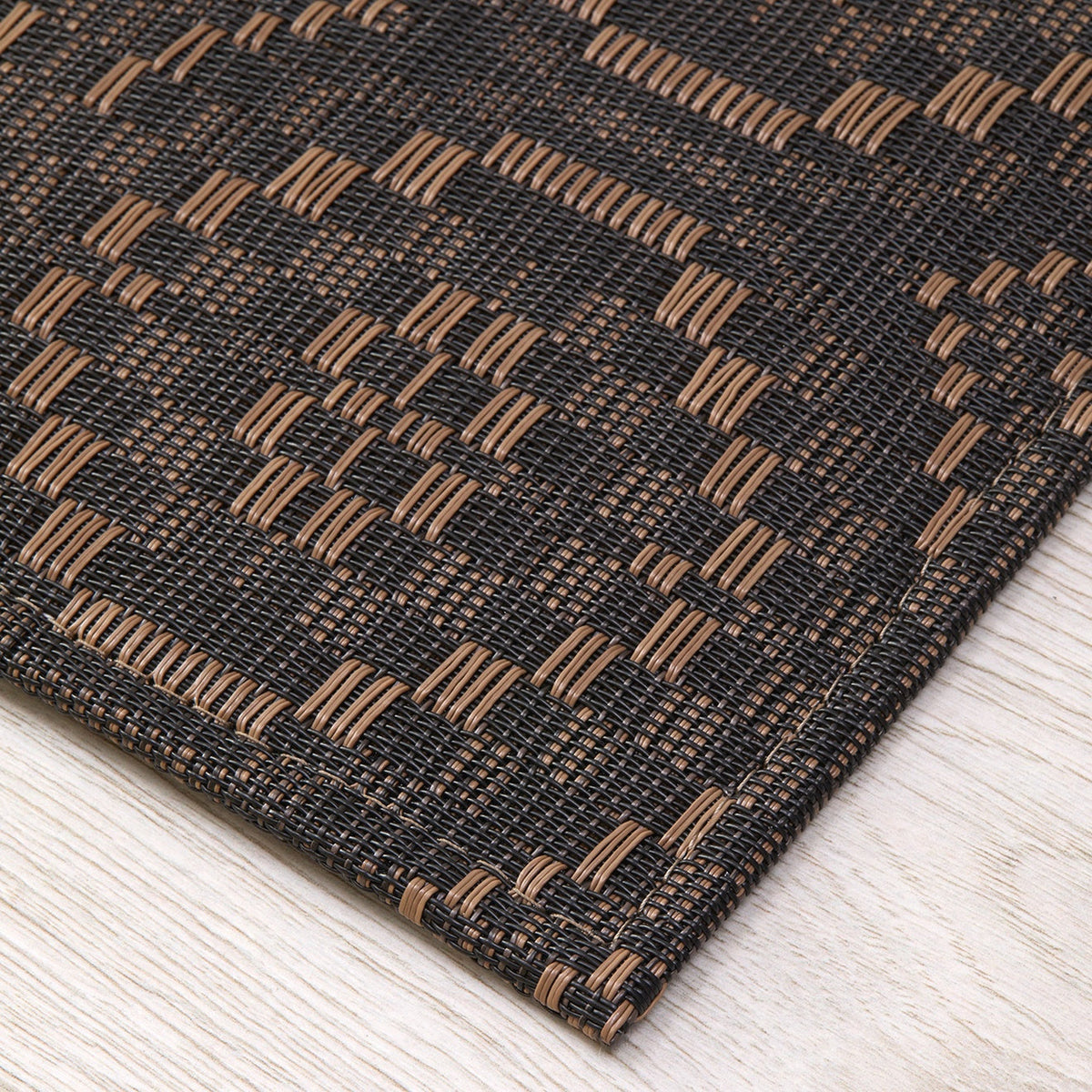 Overshot / Tiger Eye woven floor mat by Chilewich, interior setting