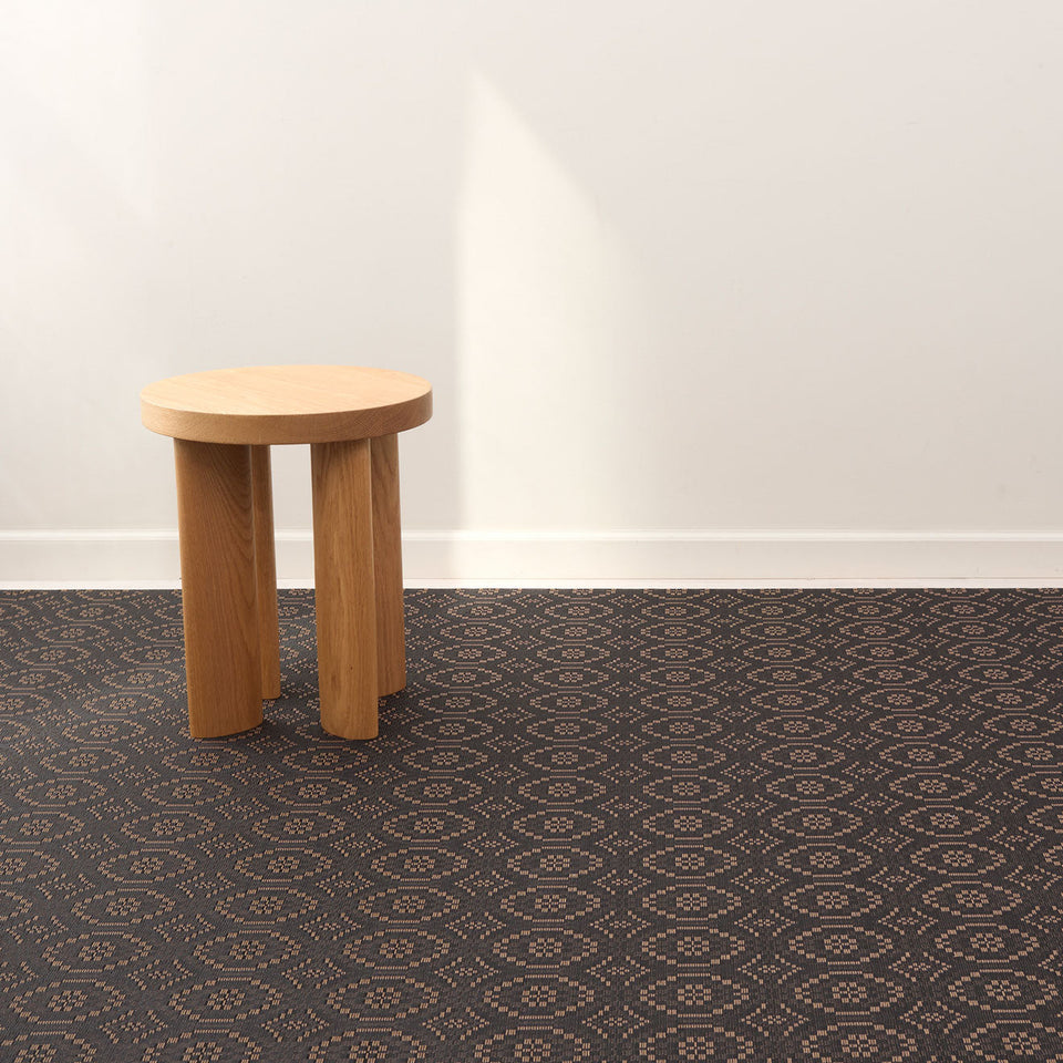 Overshot / Tiger Eye woven floor mat by Chilewich, interior setting