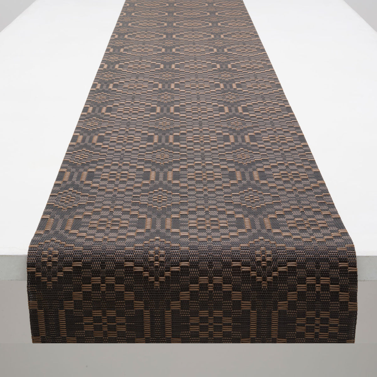 Chilewich Overshot runner in Tiger Eye, draped along a table