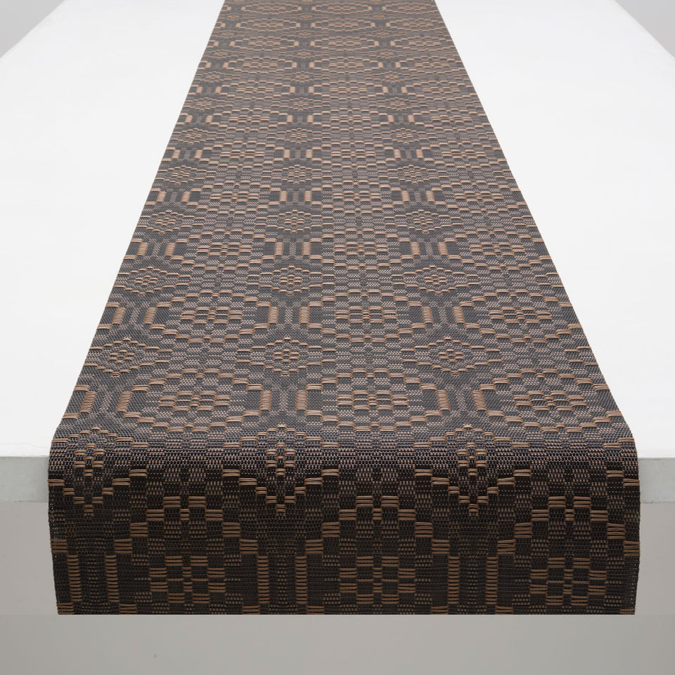 Chilewich Overshot runner in Tiger Eye, draped along a table