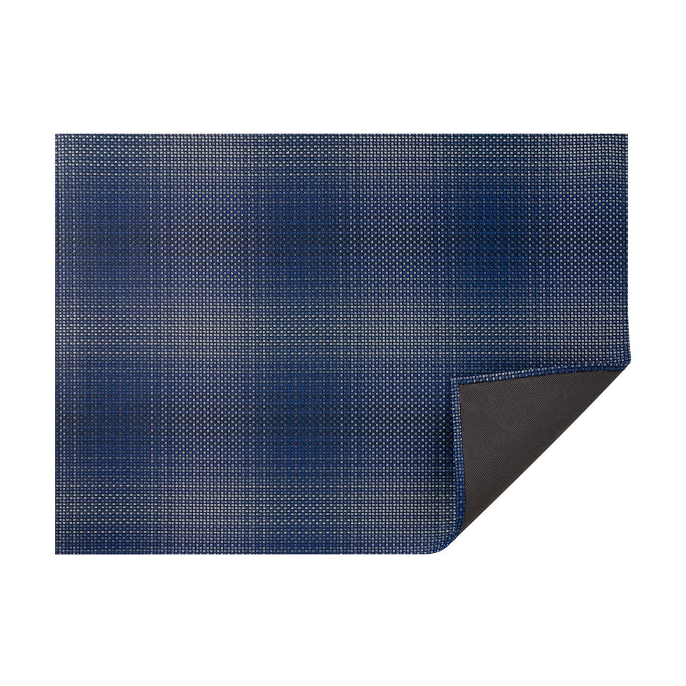 Ocean Parade woven floor mat by Chilewich, horizontal folded-corner view