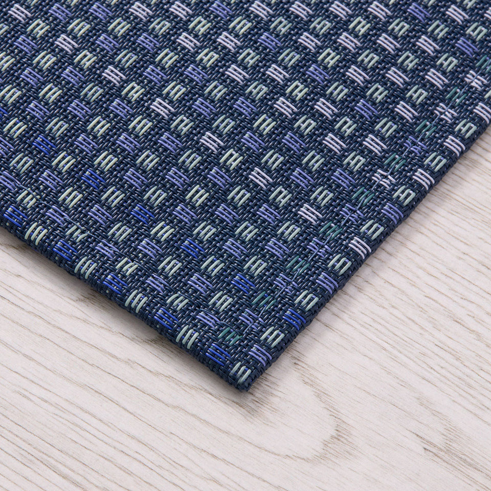 Parade / Ocean woven floor mat by Chilewich, interior setting