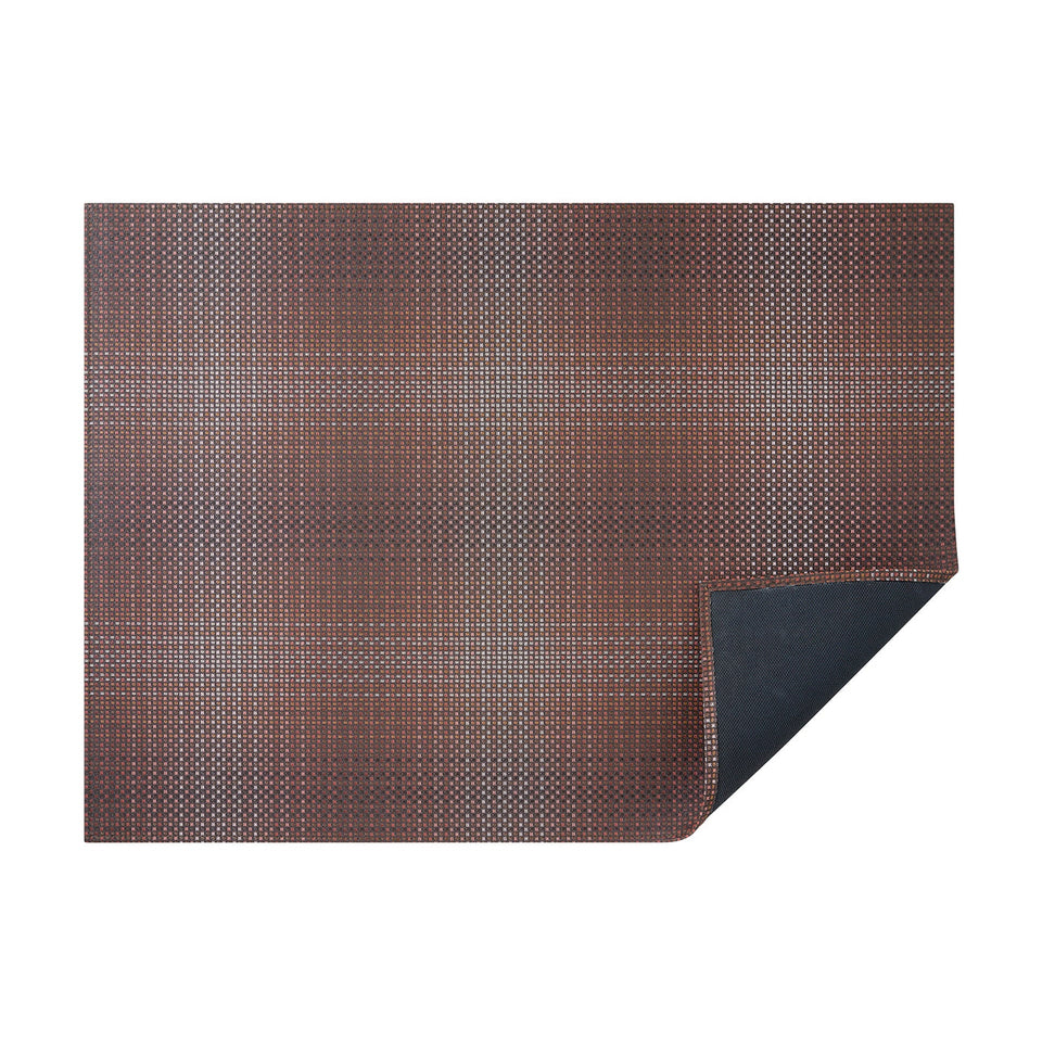 Raisin Parade woven floor mat by Chilewich, horizontal folded-corner view