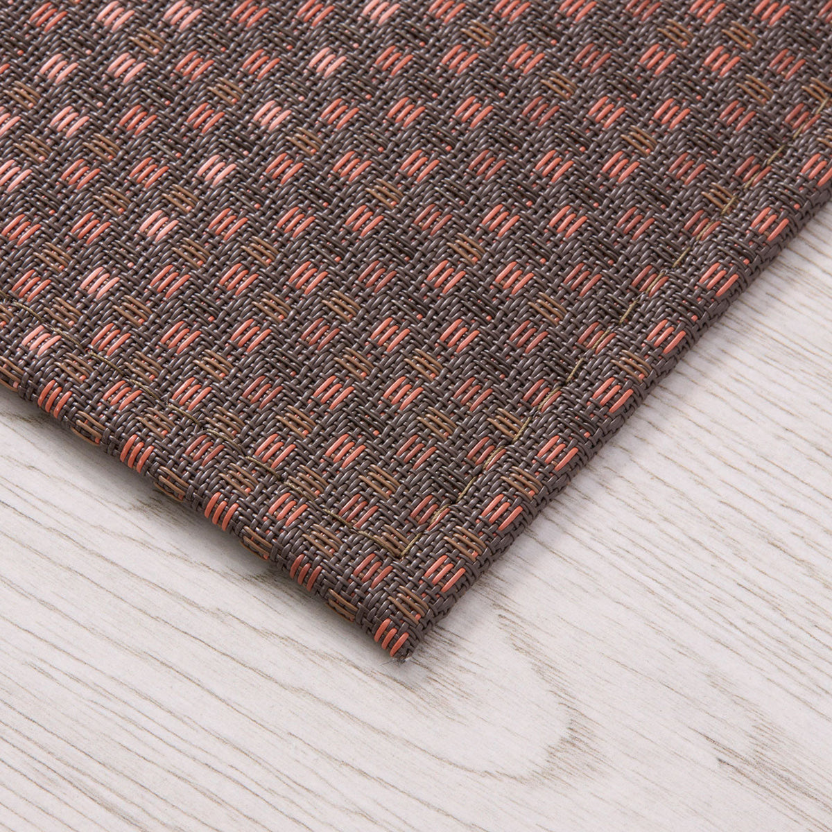 Parade / Raisin woven floor mat by Chilewich, interior setting