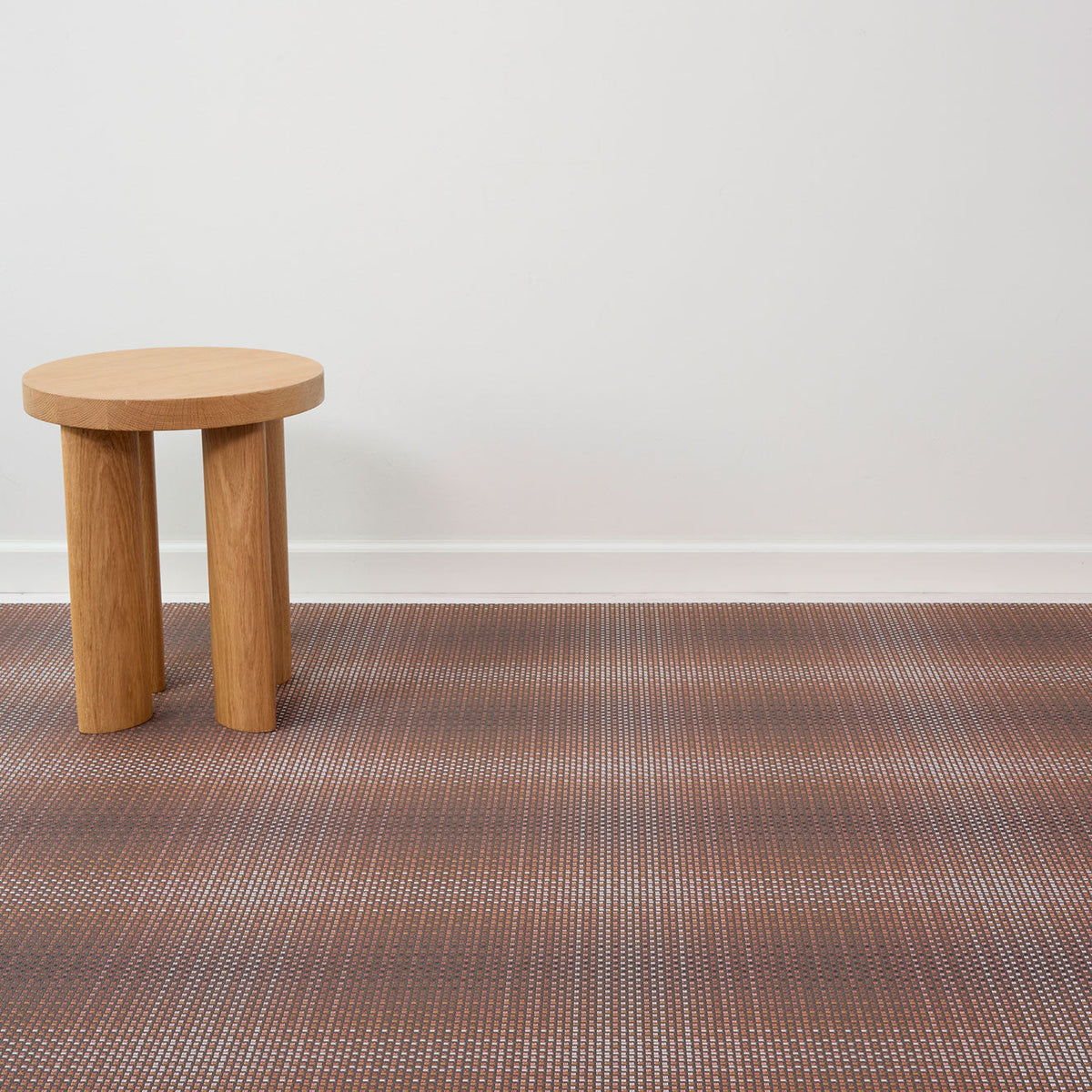 Parade / Raisin woven floor mat by Chilewich, interior setting