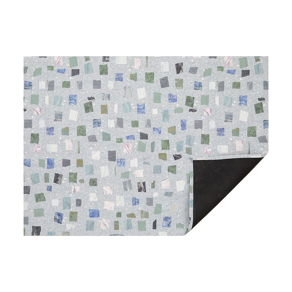 Deep Sea Pietra woven floor mat by Chilewich, horizontal folded-corner view