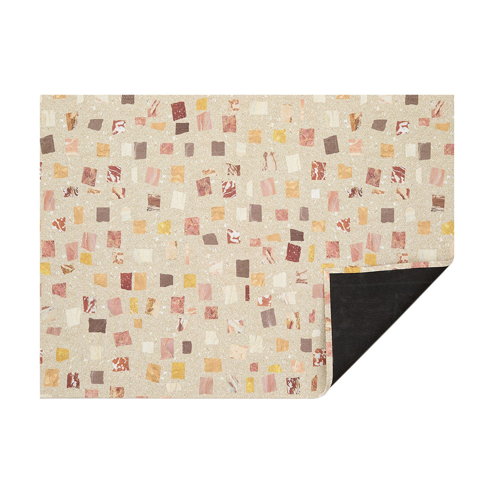 Desert Pietra woven floor mat by Chilewich, horizontal folded-corner view