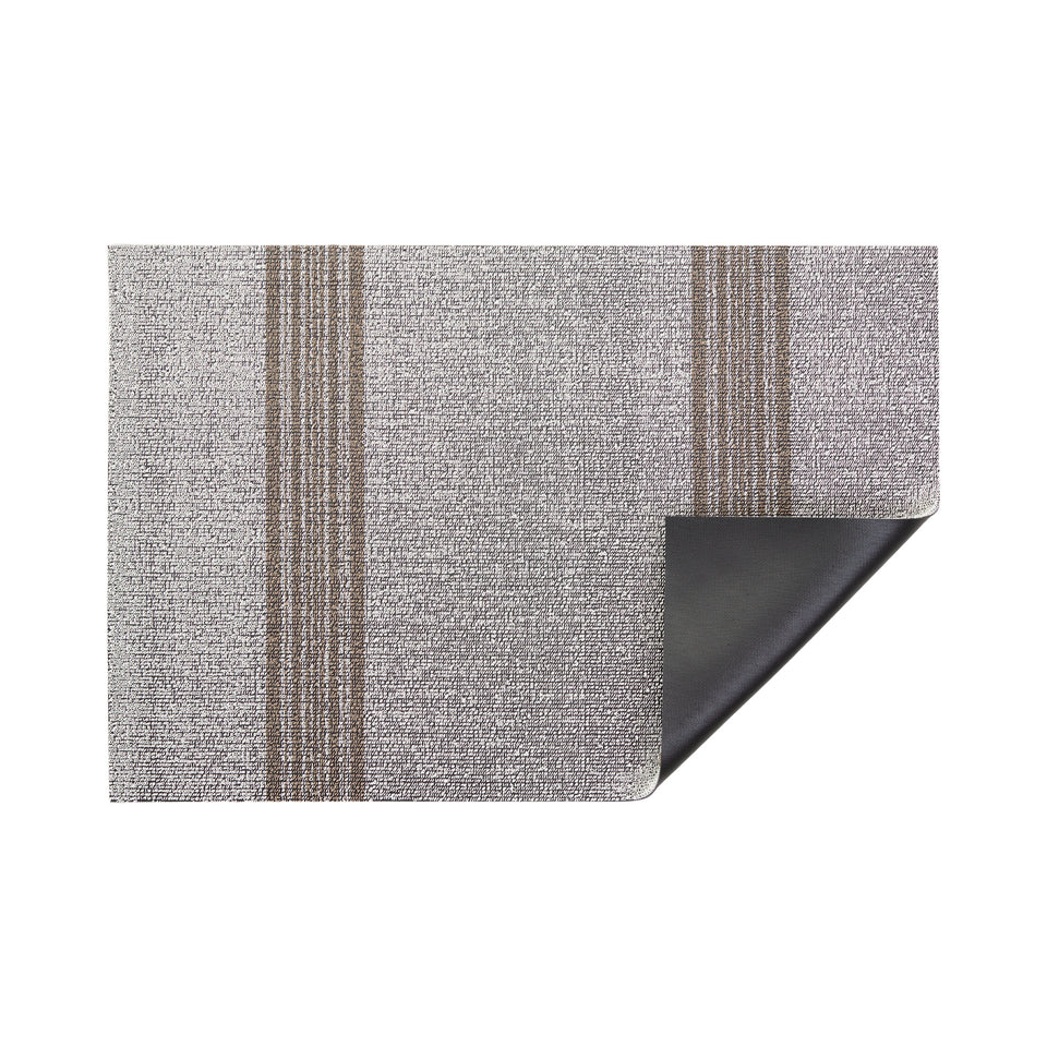 Ivory Relay Stripe Shag Mat by Chilewich — folded corner showing the vinyl backing