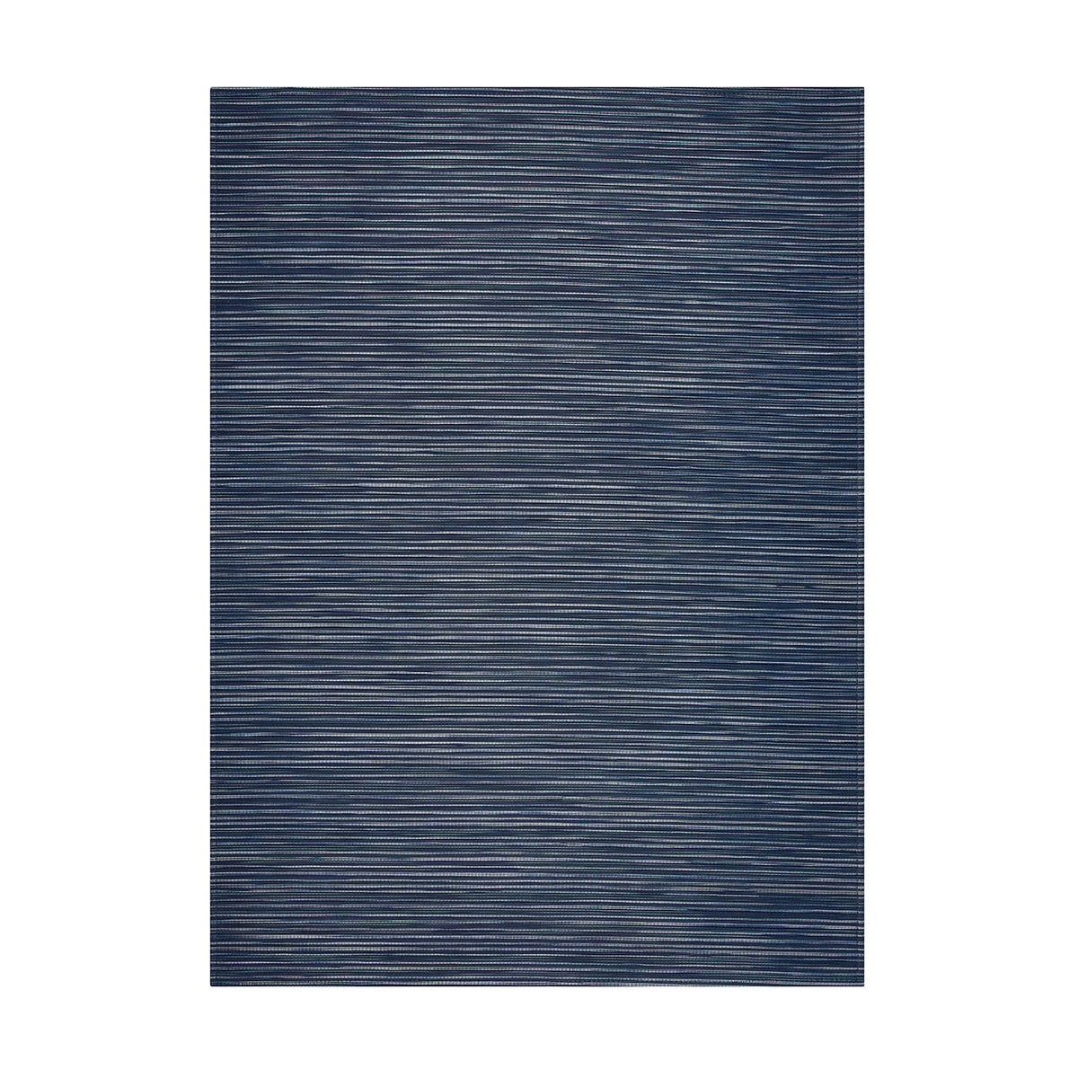 Rib Weave / Indigo woven floor mat by Chilewich, studio view