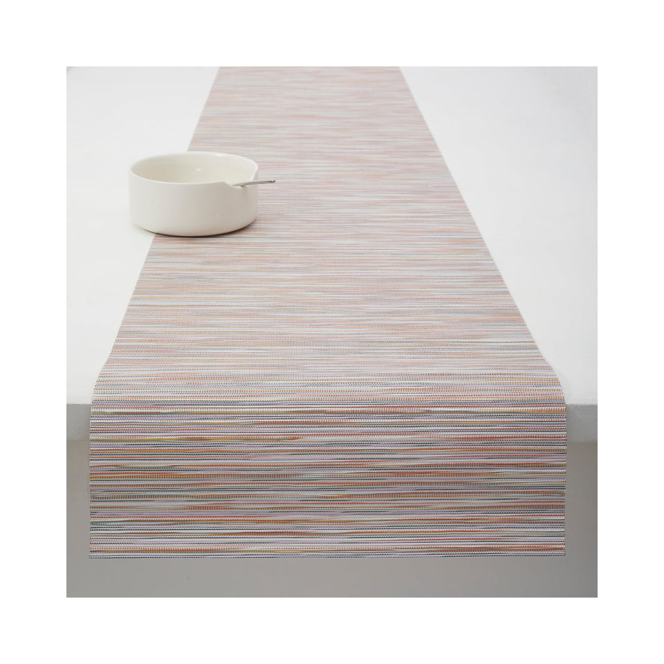 Chilewich Rib Weave table runner in Spice, draped across a table