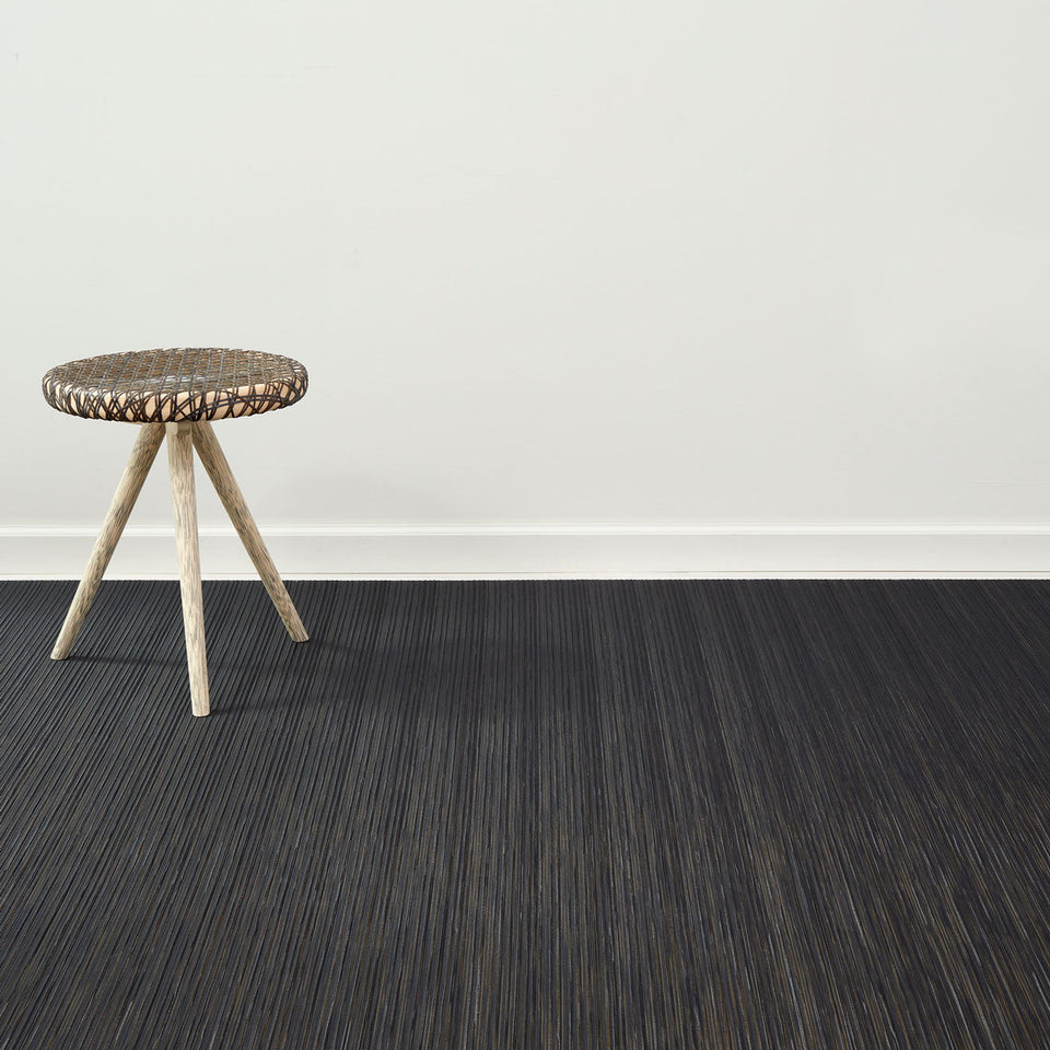 Rib Weave / Tiger Eye woven floor mat by Chilewich, interior setting