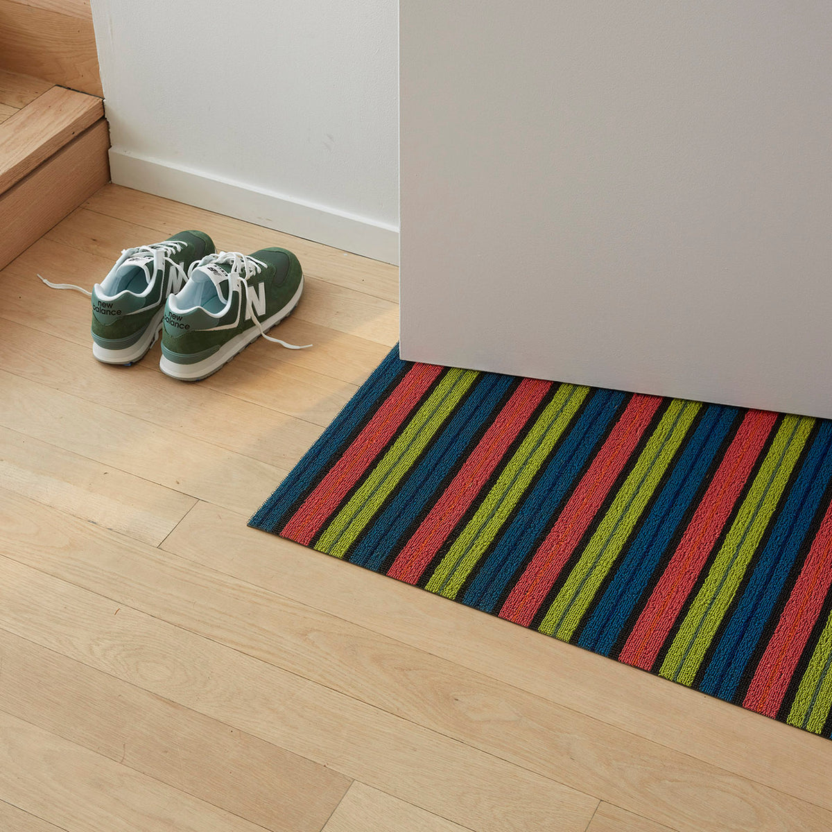 Limelight Ribbon Stripe Shag Mat by Chilewich — in an indoor setting