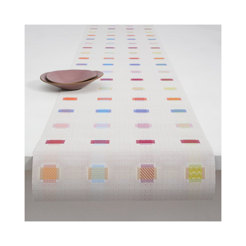 Chilewich Sampler table runner in Multi, draped across a table