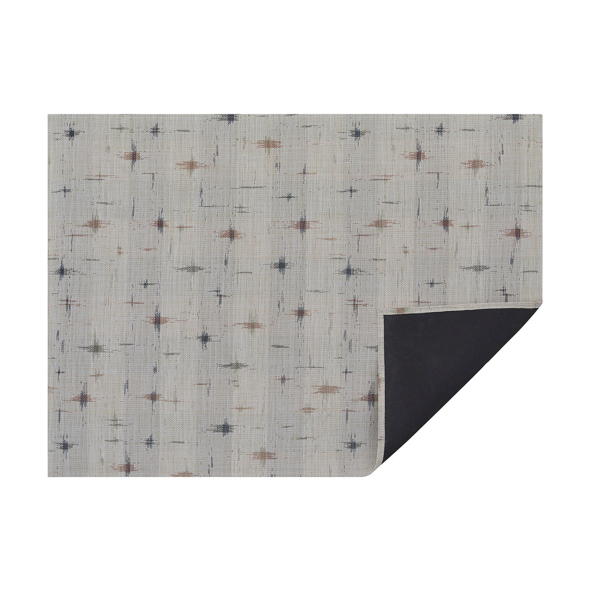 Almond Spark woven floor mat by Chilewich, horizontal folded-corner view