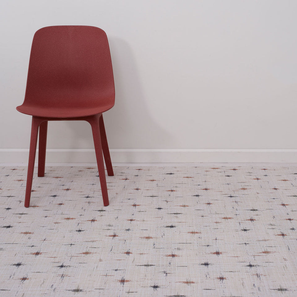 Spark / Almond woven floor mat by Chilewich, interior setting