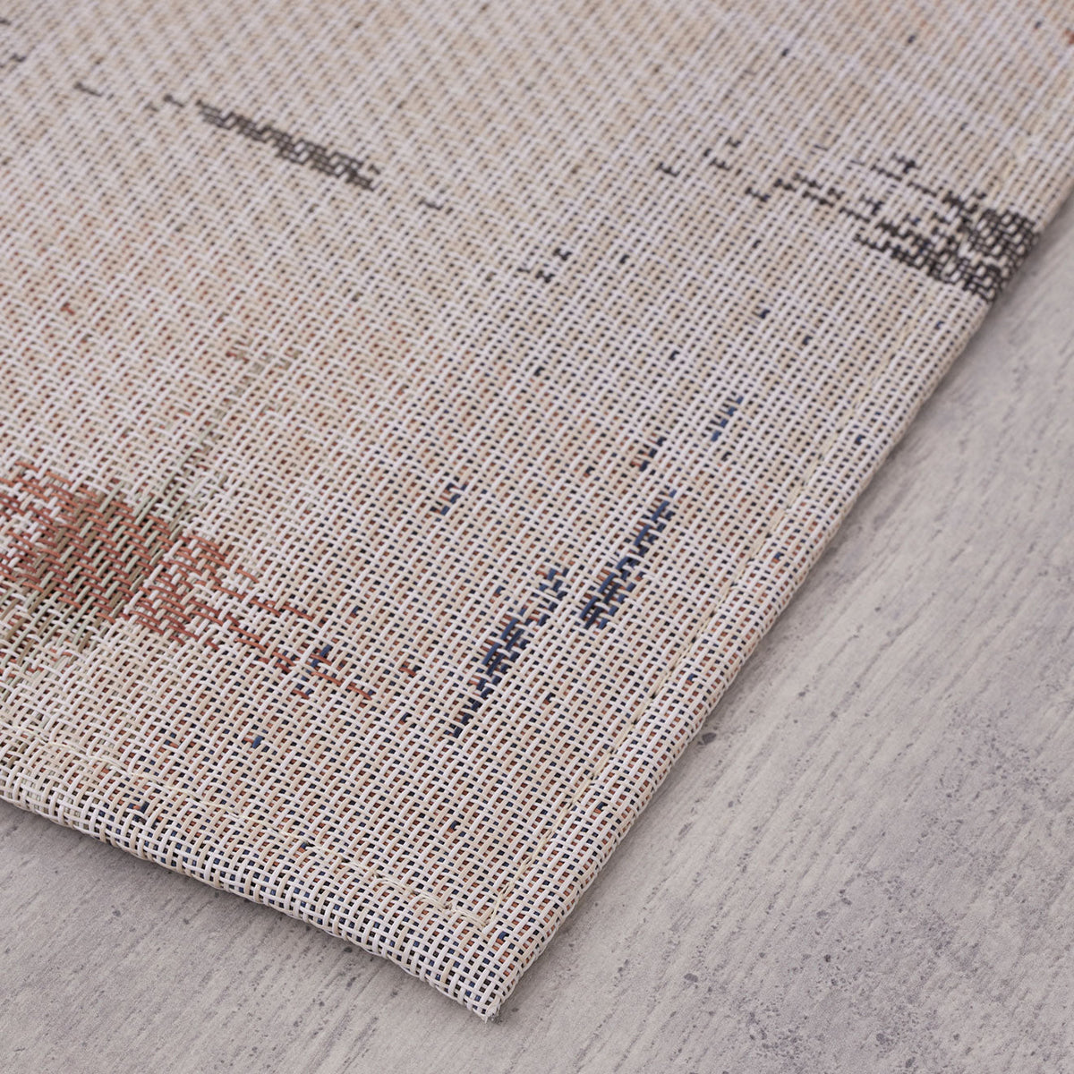 Spark / Almond woven floor mat by Chilewich, interior setting