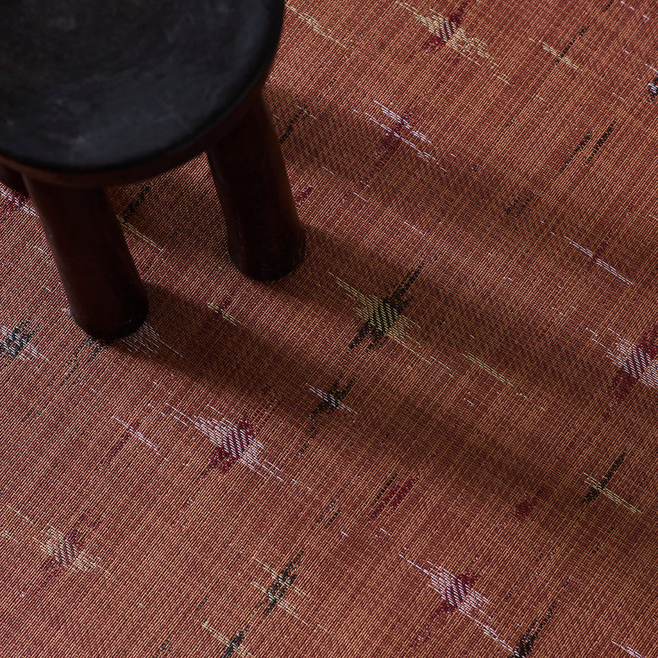 Spark / Cider woven floor mat by Chilewich, interior setting