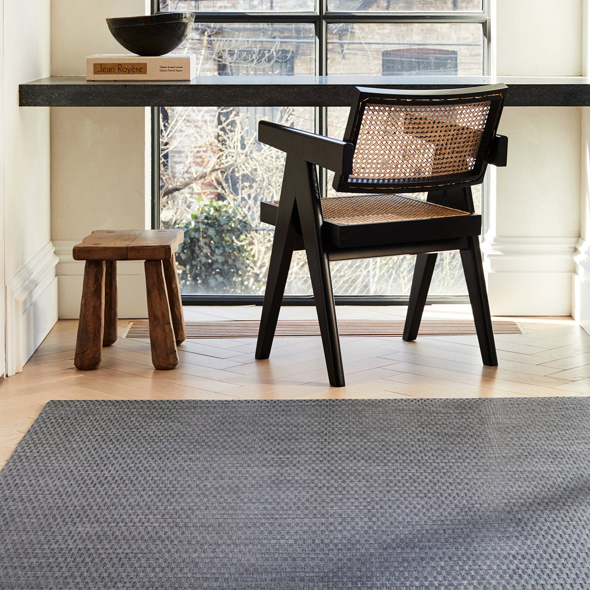 Thatch / Pewter woven floor mat by Chilewich, interior setting