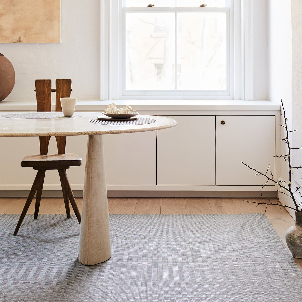 Thatch / Umber woven floor mat by Chilewich, interior setting