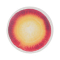 Chilewich Vegetables round placemat in Carrot, viewed from above on a white background
