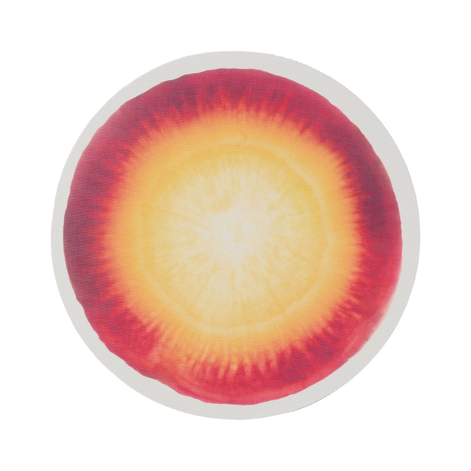 Chilewich Vegetables round placemat in Carrot, viewed from above on a white background