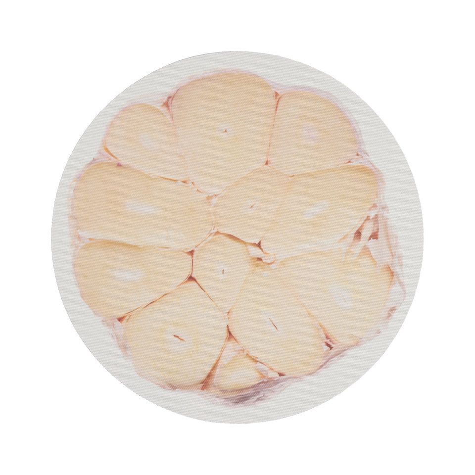 Chilewich Vegetables round placemat in Garlic, viewed from above on a white background