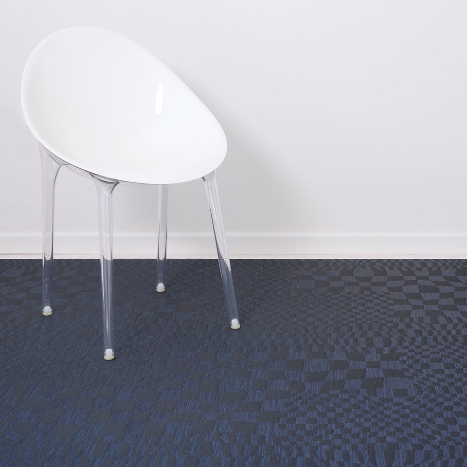 Warp / Ocean woven floor mat by Chilewich, interior setting