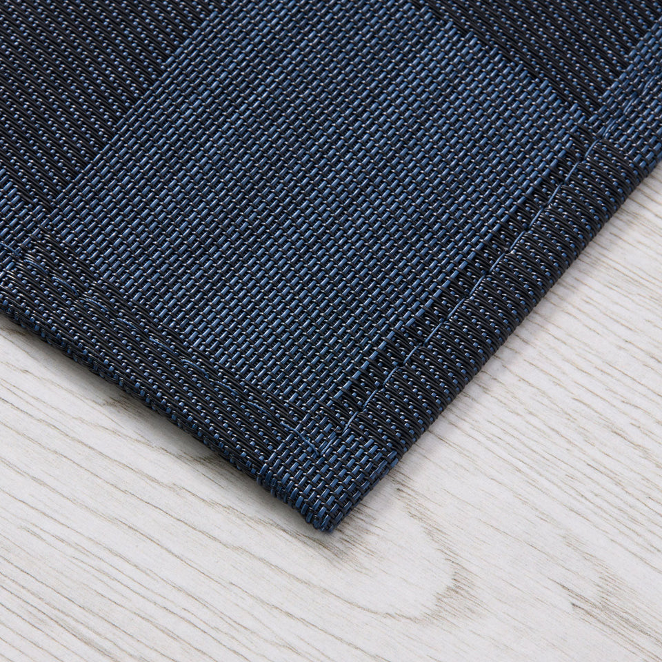 Warp / Ocean woven floor mat by Chilewich, interior setting