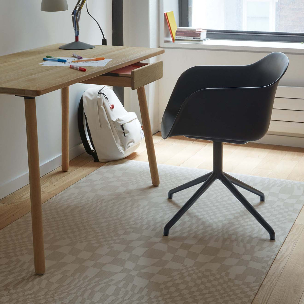 Warp / Sand woven floor mat by Chilewich, interior setting