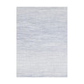 Wave / Blue woven floor mat by Chilewich, studio view