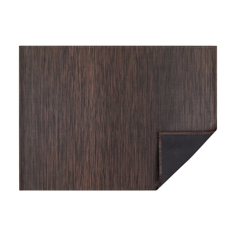 Tiger Eye Wave woven floor mat by Chilewich, horizontal folded-corner view